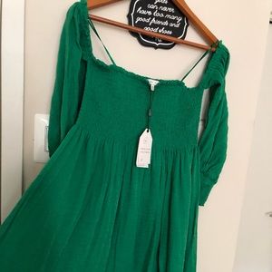 Green smock bodice off—shoulder dress